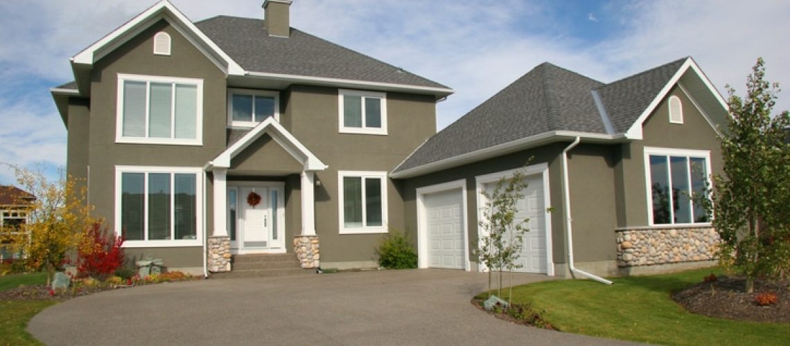 Long driveway leading up to an estate house